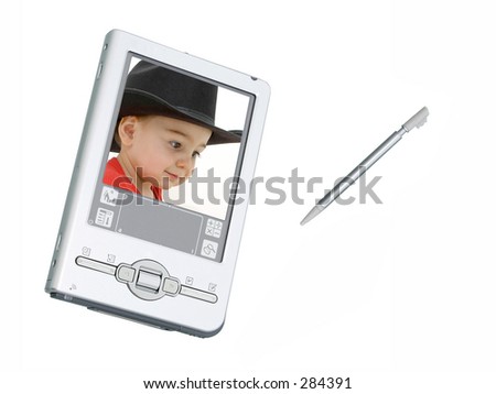 Silver palmtop (personal organizer) / digital camera over white with screenshot of toddler boy in black cowboy hat.