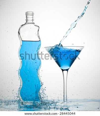 Cocktail and creative splashing.Isolated on white