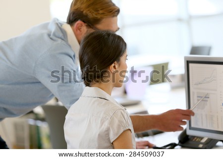 Creative people working in office on computer