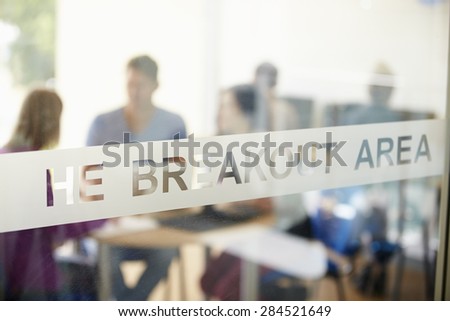 Mature Students Working In College Breakout Area