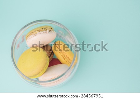 Macaroons on retro vintage background color
