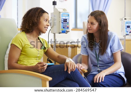 Woman Undergoing Chemotherapy With Nurse