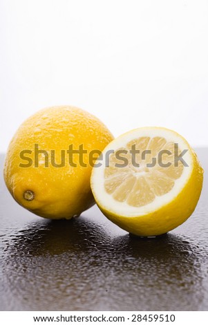 Fresh lemon with dew drops