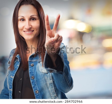 woman doing a number two gesture