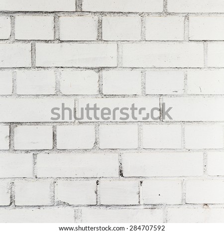 old white painted bricks at an old house wall