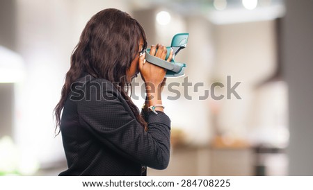 happy black woman with camera