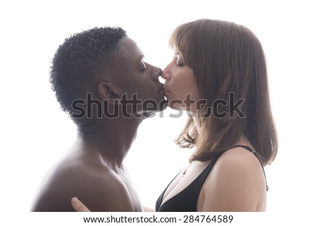 Loving African American caucasian couple kissing