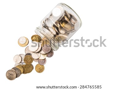 Malaysian coins in a mason jar over white background