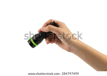 Hand-hold black Flashlight torch shines light lighting up an isolated white. object emergency electric tool energy lamp lantern led battery power for security search or direction view finding in dark. Royalty-Free Stock Photo #284797499