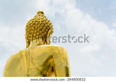 Golden Buddha statue of Big Buddha over blue sky. Chiang rai in thailand.