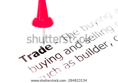Word TRADE pinned on white paper with red pushpin, available copy space. Business Concept