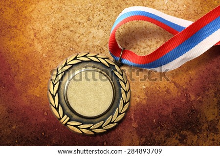 Blank metal medal with tricolor ribbon closeup