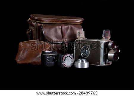 Old camera back to the 1950 with light meter, lens, and original leather case.