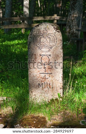 Milestone by the roadside in the countryside