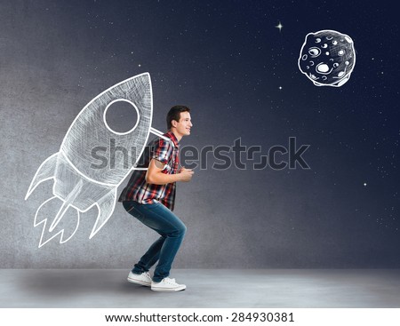Young man with a rocket on his back Royalty-Free Stock Photo #284930381