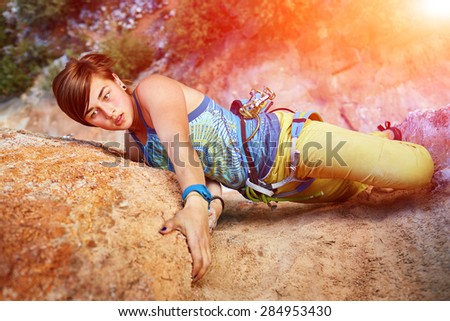 female rock climber climbs on a rocky wall. Turkey, Geyikbayiri, Sarkit sector.