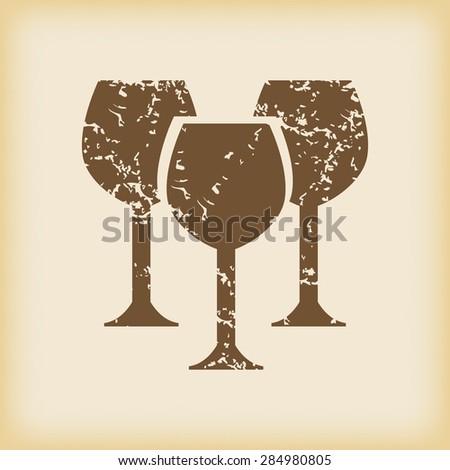 Grungy brown icon with image of three wine glasses, on beige background