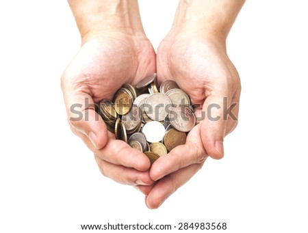 Handful of coins in palm hands isolated on white Royalty-Free Stock Photo #284983568