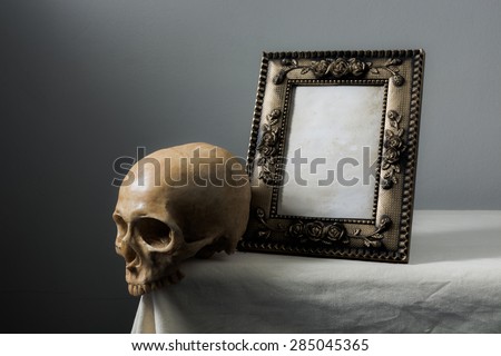 Still life with frame and skull