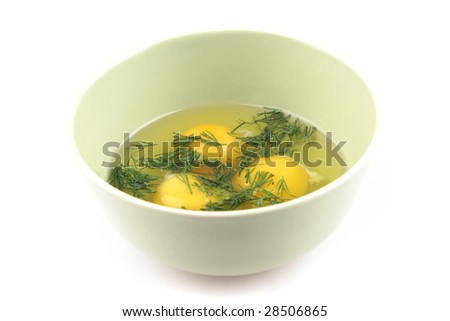 eggs and greenery in big bowl over white