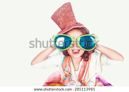 funny little girl with confetti and sunglass Royalty-Free Stock Photo #285113981