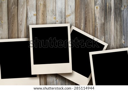 Blank images on a wooden background