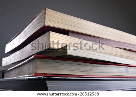 Stack of books with covers of different colors