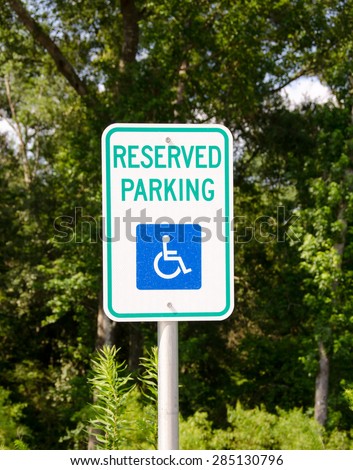Reserved for handicapped parking sign.