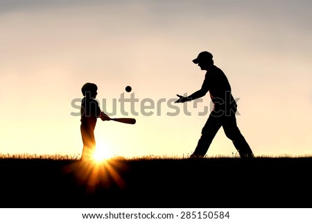 A silhouette of a father and his young child playing baseball outside, isolated against the sunsetting sky on a summer day. Royalty-Free Stock Photo #285150584