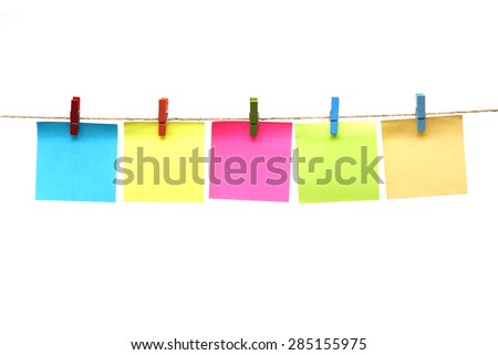 colorful paper cards hung on rope isolated on white background