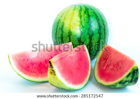 A watermelon with a slice cuts isolated on white background