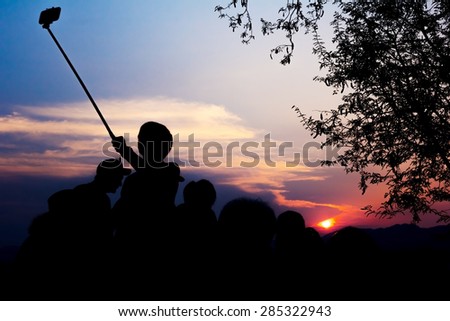Silhouette Of Travelers Enjoy Their Moment Watching Sunset