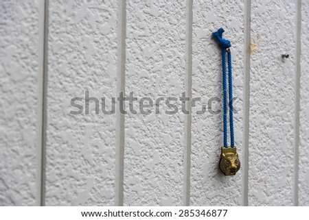 mini bell key with old door
