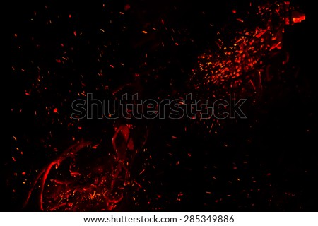 red  hot sparks on a black background