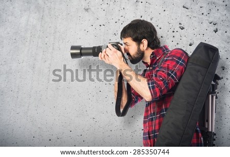 Photographer taking a photo over textured background