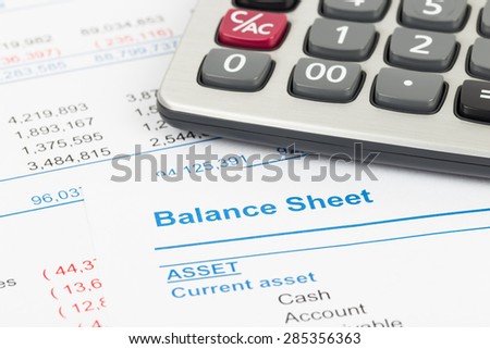 Balance sheet report with calculator; document is mock-up
