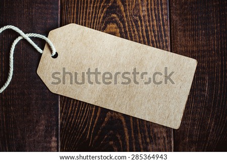 Blank tag on dark wood background