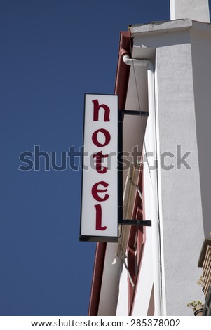 Hotel Sign against Blue Sky Background