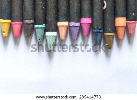 Crayons lying isolated with copy space background