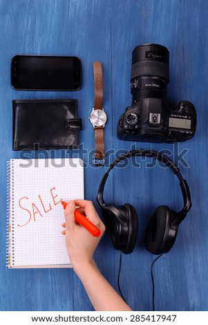 Sale unwanted stuff on wooden background top view