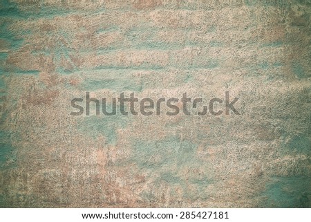 Old golden and green brick wall background or texture
