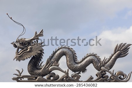 metal dragon statue in sky.