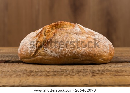 Close up of white bread over wooden background