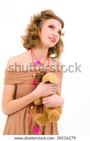 Picture of a dreaming girl holding a teddy bear