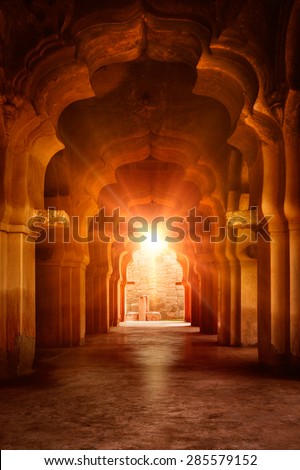 Old ruined arch in ancient palace at sunset, India Royalty-Free Stock Photo #285579152