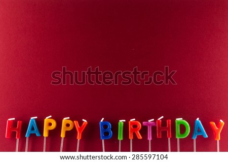 Many Colored Candles with Text Happy Birthday