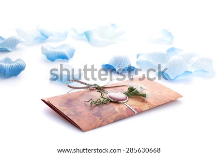 Hand made wedding invitation with flower decoration isolated on white