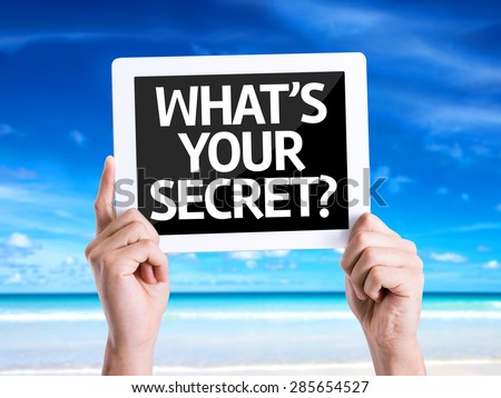Tablet pc with text Whats Your Secret? with beach background