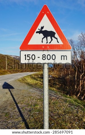 Moose crossing road sign 
