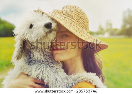 young woman and her dog Royalty-Free Stock Photo #285753746